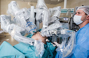 A surgeon undertaking robotic surgery