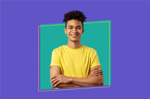 A purple box with a green box in the middle. In the green box there is a male with black hair smiling in a yellow top.