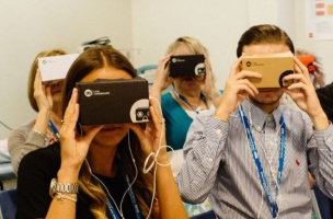 A group of men and women wearing virtual reality headsets.