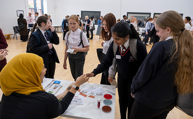 5 students speaking to an NHS Ambassador at Sheffield University Technical College